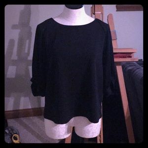 Black shirt/ blouse.